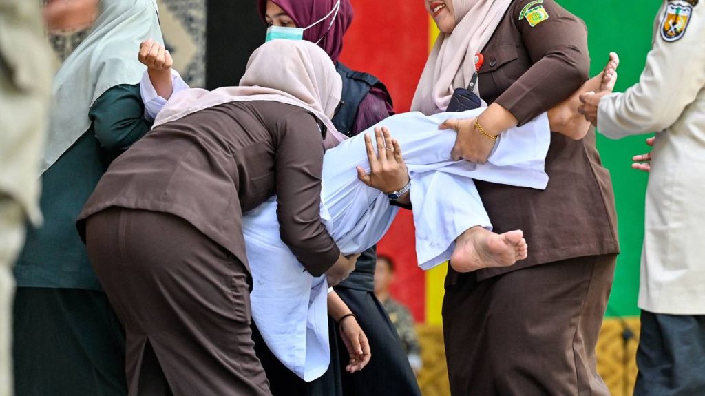 Woman faints after 100 lashes for sex outside marriage ‘conviction’ in Indonesia