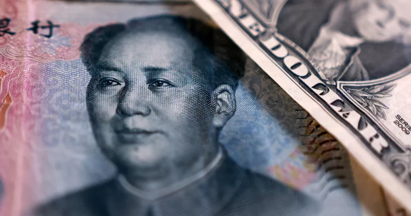 China banks raise dollar deposit rates to curb yuan appreciation