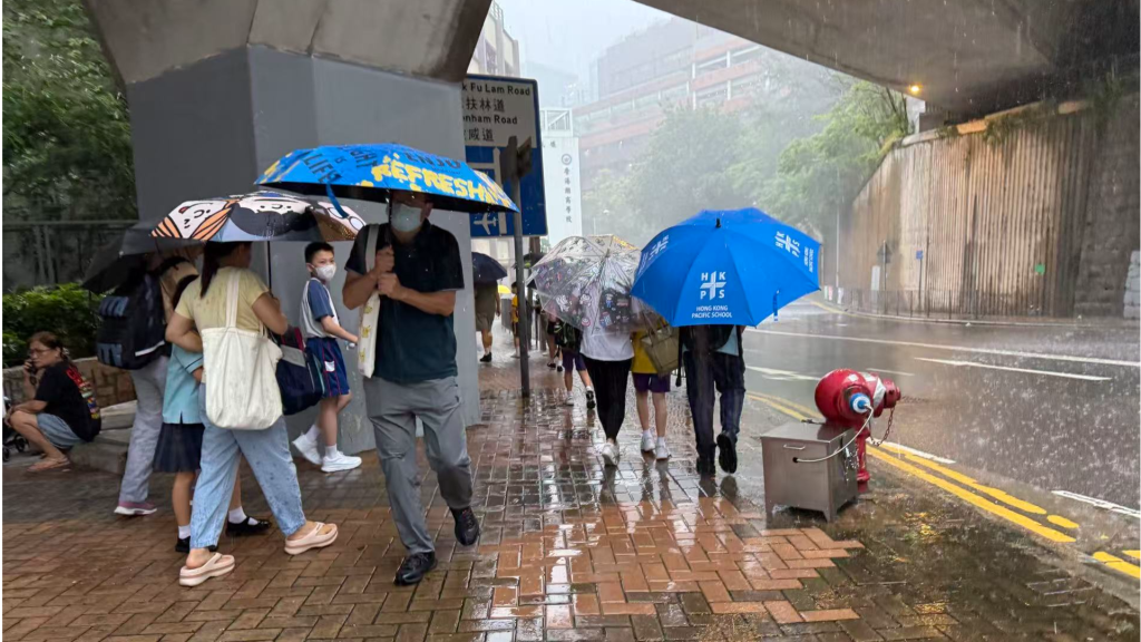 Hong Kong hoists amber rainstorm signal as heavy downpour lashes city