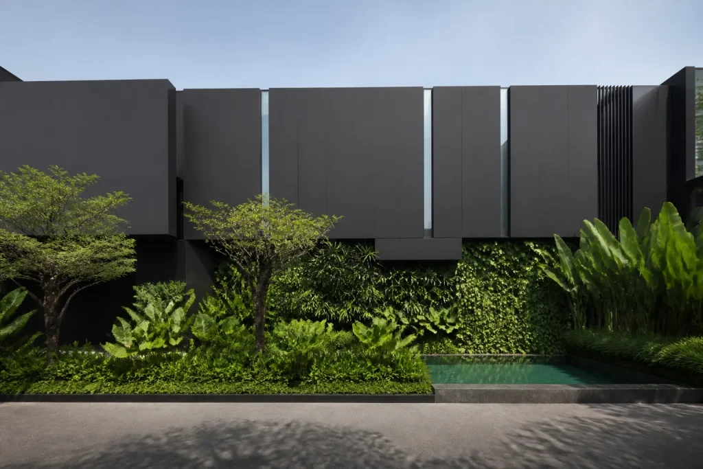 Black house with few visible windows designed near Jakarta